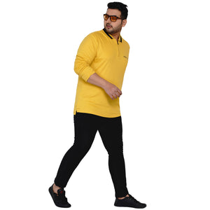 Plus size Indian model wearing yellow t-shirt 